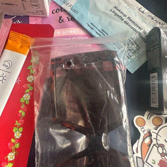 Michael Kors Navy and Cream Striped Tote stuffed with jewelry and skincare - Picture 6 of 10